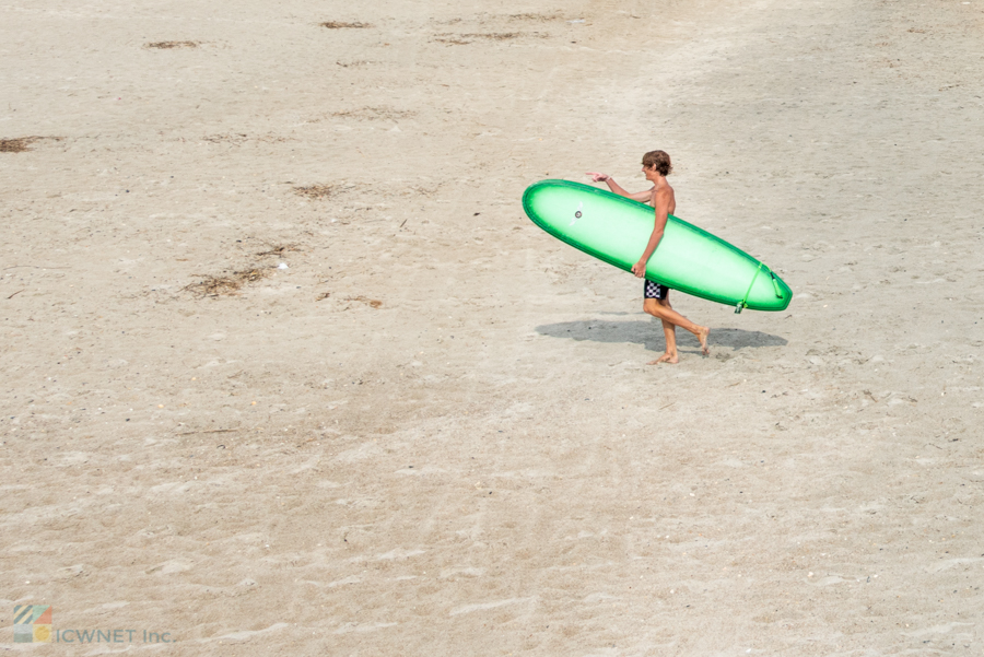 A surfer on Atlantic Beach, NC