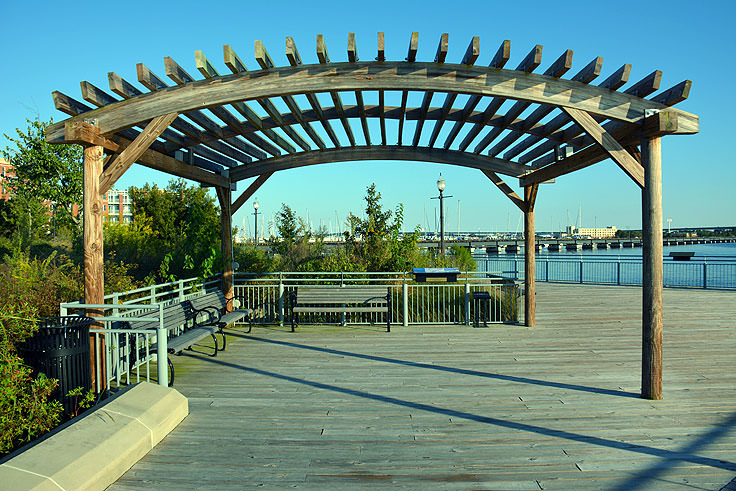 Shaded benches along the water at Union Point Park in New Bern, NC