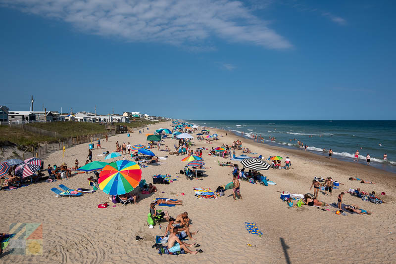 Sunbathers next to Bogue Inlet Fishing Pier